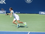 Stefanos Tsitsipas (GRE) is chasing the ball behind baseline on Centre Court