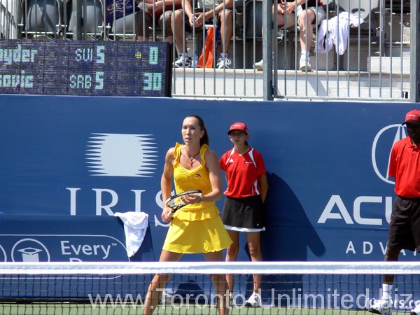 Jelena Jankovic on Grandstand Court playing Patty Schnyder.