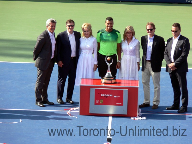 Jo-Wilfried Tsonga surranded by Rogers Cup organizing committee August 10, 2014 Rogers Cup Toronto