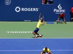 Ivan Dogic (CRO) serving with Marcelo Melo. Doubles Final August 10, 2014 Rogers Cup Toronto