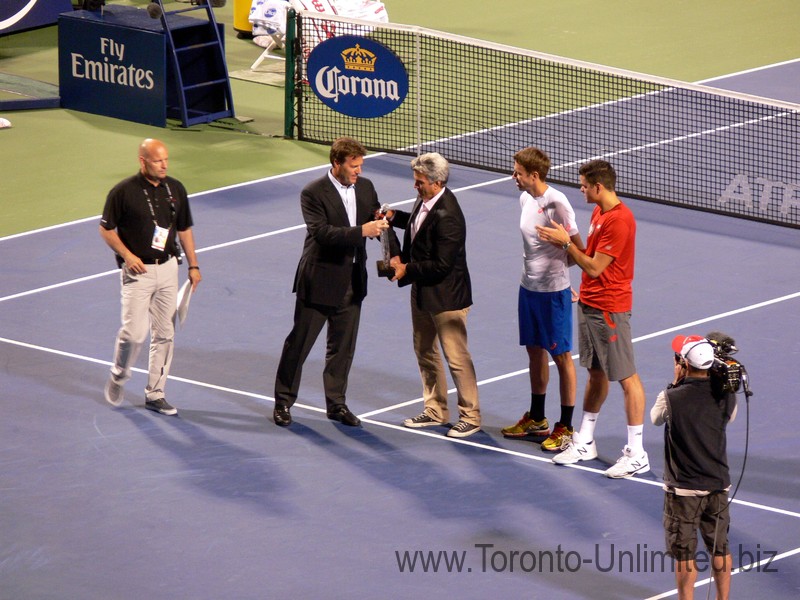 CEO ATP Americas Mark Young presents Tournament Director Karl Hale with a trophy August 6, 2014 Rogers Cup Toronto 