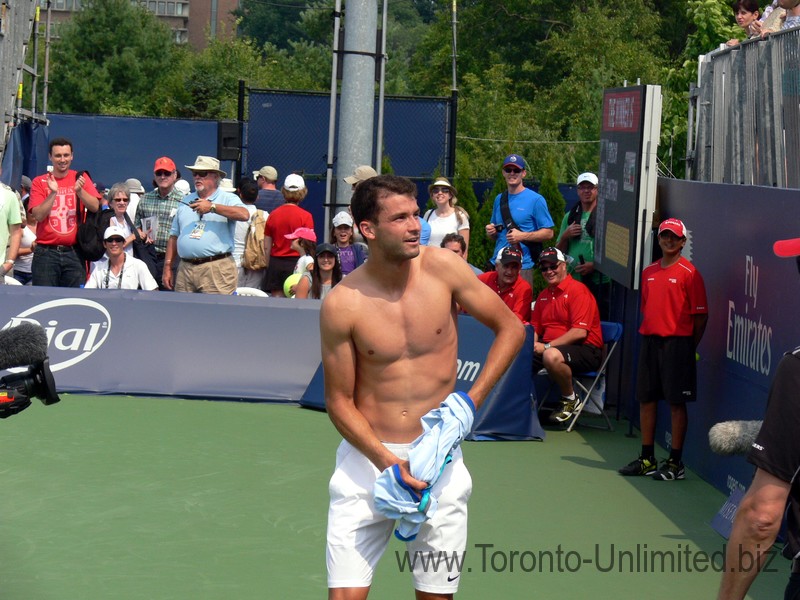 Shirtless and happy Grigor Dimitrov giving his shirt away after the win over Tommy Robredo (ESP) August 7, 2014 Rogers Cup Toronto