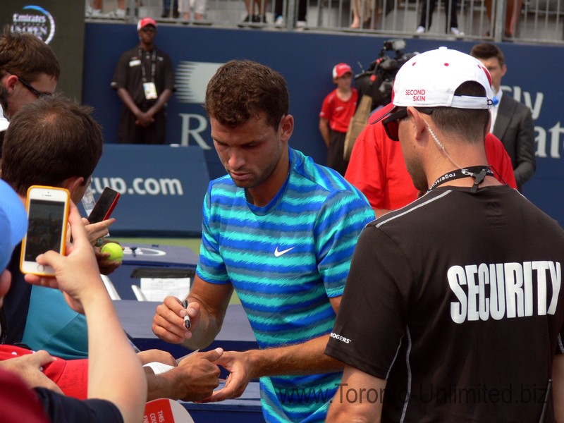 Grigor Dimitrov (BUL) signing autographs on Grandstand Court August 7, 2014 Rogers Cup Toronto