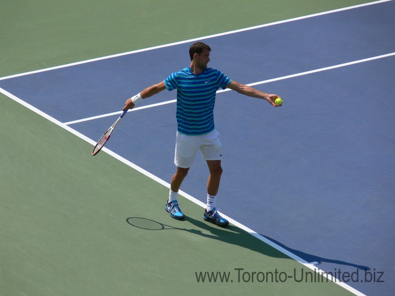 Grigor Dimitrov is preparing his toss up to serve. Stadium Court August 9, 2014 Rogers Cup Toronto