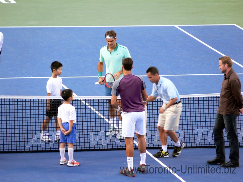 Coin toss; Roger Federer and Feliciano Lopez on the Stadium Court August 9, 2014 Rogers Cup Toronto
