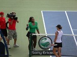 Serena Williams Champion shakes hands with Samantha Stosur