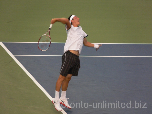 Bernard Tomic serving to Novak Djokovic on Central Court August 8, 2012 Rogers Cup.