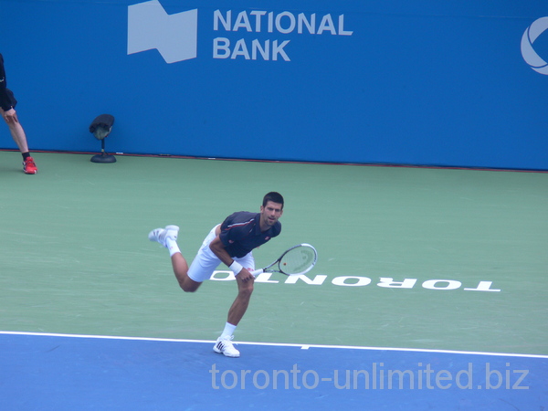 Novak Djokovic getting balance after his serve against sam Querrey, August 10, 2012 Rogers Cup. 