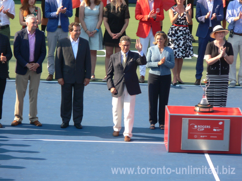 Tennis Canada Organizing Committee, from the left;  Dale Hooper  Rogers Communication Brand Officer, Ghislain Parent of National Bank, Mike Tevlin with raised hand  Tennis Canada Board of Directors, Giulia Orlandi  WTA Supervisor and Wanda Restivo 40 years as Tennis Volunteer. Rogers Cup Doubles Closing Ceremony 16 August 2015.   