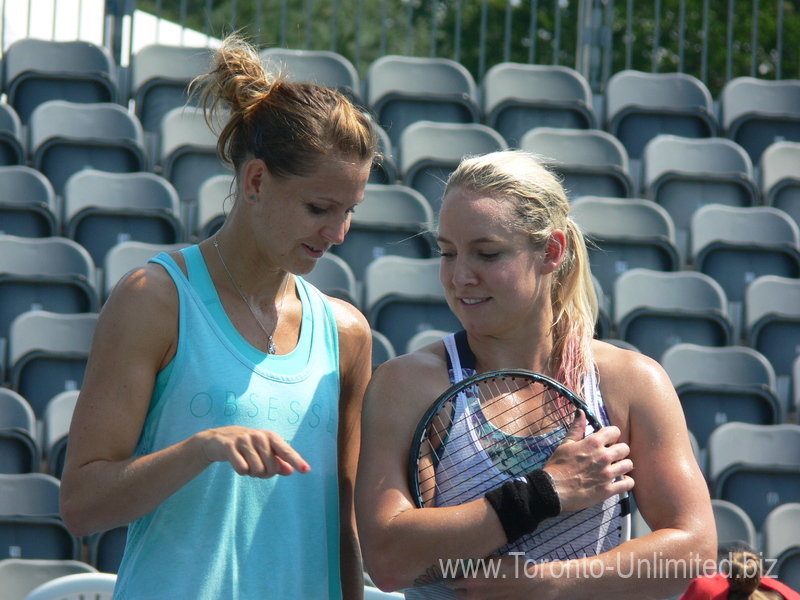 Lucie Safarova and Bethanie Mattek-Sands are deeply interested in something. 16 August 2015 Rogers Cup Toronto!