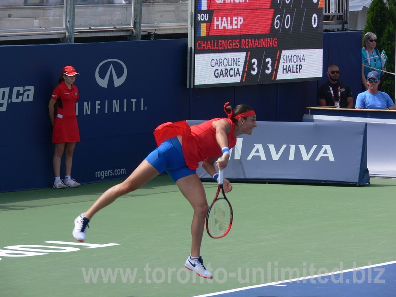 Caroline Garcia (FRA) serving to Simona Halep (ROU) on Central Court in an evening match 11 August 2017 Rogers Cup.