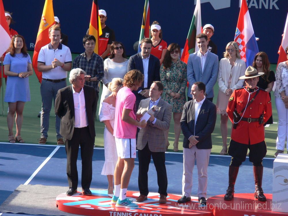 Stefanos Tsitsipas getting Runners Up Trophy from Louis Vachon
