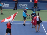 Rising Canadian Star Bianca Andrescu and Canadian Flag, coming to Centre Court to play quarterfinal match August 9, 2019 Rogers Cup Toronto.