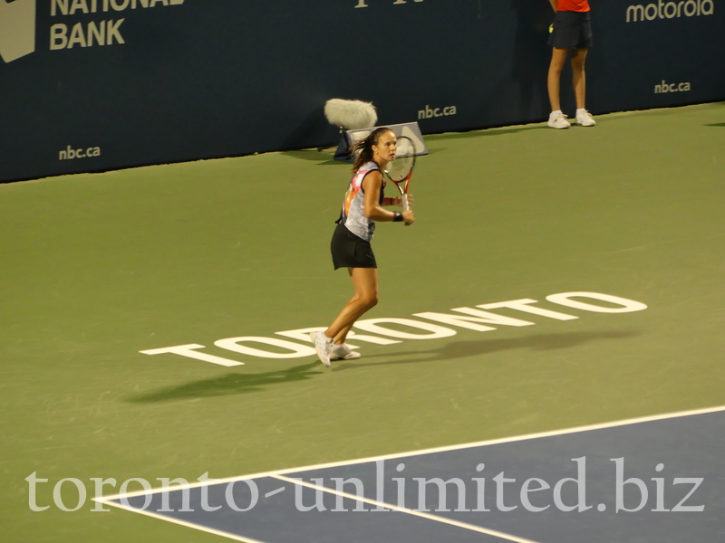 Daria Kasatkina with a nice expression on her face is preparing to return backhand standing on the sign of TORONTO Tuesday August 9, 2022