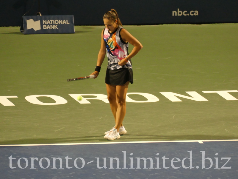 Daria Kasatkina is preparing to serve Bianca Andreescu on Stadium Court, standing on the sign TORONTO. August 9, 2022