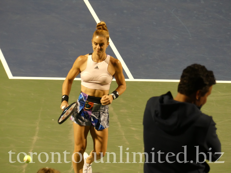 Maria SAKKARI GRE with a confident expression to the baseline to start to warm up with Sloane STEPHENS to on Stadium Court August 9, 2022