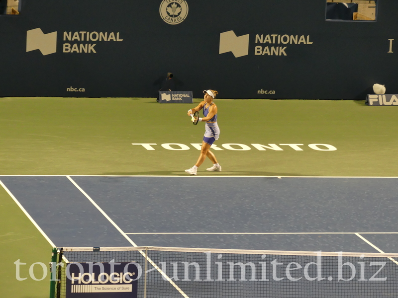 Belinda Bencic, with an iconic TORONTO sign behind the baseline, is preparing her serving to Serena Williams on the Stadium Court Wednesday, August 10, 2022