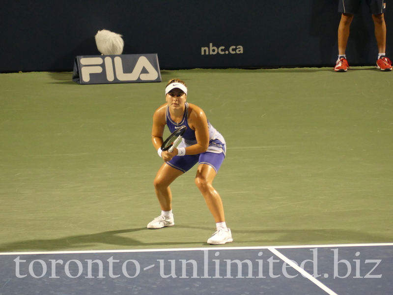 Concentrated Bianca Andrescu behind the base in a match against Alize Cornet of France, Wednesday, August 10, 2022
