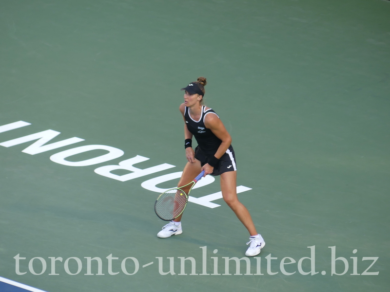 Beatriz HADDAD MAIA BRA is standing behind the baseline on an iconic TORONTO sign in Semifinal match against Karolina Pliskova on August 13, 2022