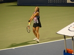 Daria Kasatkina serving on Stadium Court during evening match, to Bianca Andreescu CDN,