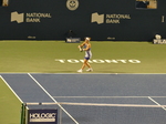 Belinda Bencic, with an iconic TORONTO sign behind the baseline, is preparing her serving to Serena Williams on the Stadium Court Wednesday, August 10, 2022