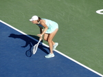 Concentrated Iga Swiatek POL and number 1 seed in a match against Beatriz HADDAD MAIA BRA on the Stadium Court Thursday, August 11, 2022