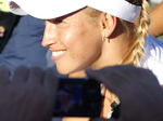 Smiling Yulia PUTINTSEVA KAZ., on NATIONAL BANK GRANDSTAND after her win Thursday, August 11, 2022