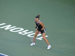 Beatriz HADDAD MAIA BRA is standing behind the baseline on an iconic TORONTO sign in Semifinal match against Karolina Pliskova on August 13, 2022