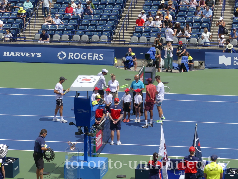 Marcelo AREVALO (ESA) and Jean-Julien ROJER (NED) on left side of the Net. Rajeev RAM (USA) and Joe SALISBURY (GBR) [3] on the right side of Net awaiting tossup.