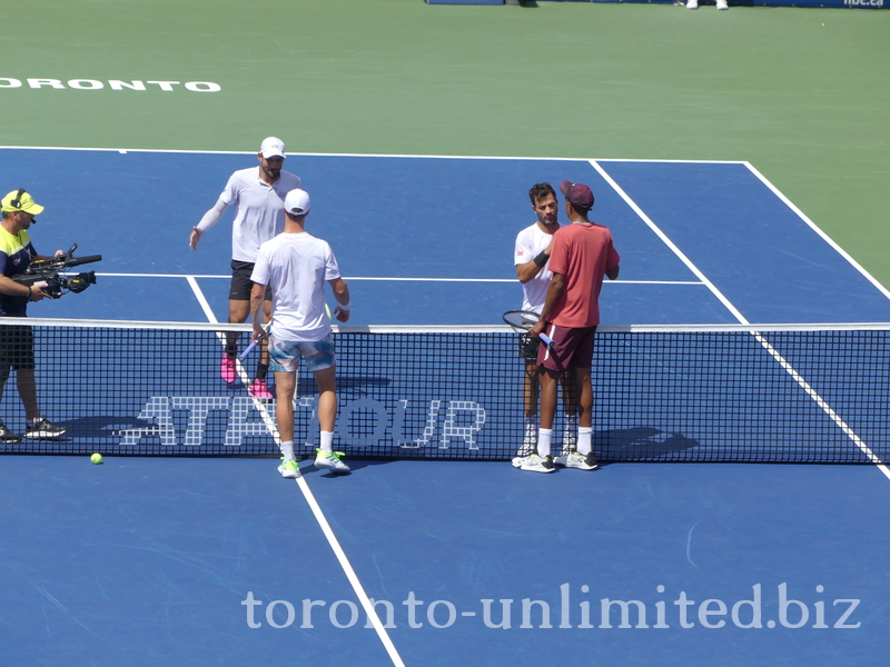 The Doubles Final Championship match is over, and competitors are shaking hands