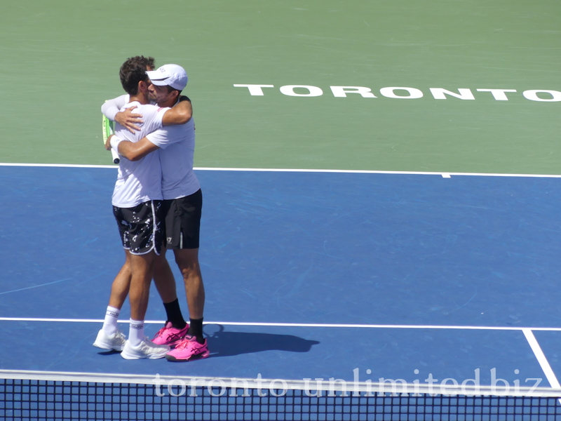 Doubles Final Champions Marcelo AREVALO (ESA) Jean-Julien ROJER (NED) embrace each other