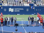 Runners-up and Champions Trophy on display between members of the Organizing Committee. 