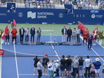 Doubles Trophies in the middle of members of the Organizing Committee awaiting presentation