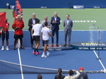 Michael Denham from National Bank presents the Championship Trophy to the winners Marcelo AREVALO (ESA) Jean-Julien ROJER (NED)