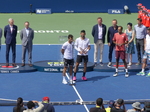 Champions Marcelo AREVALO and Jean-Julien ROJER speaking in front of a microphone to the crowds 