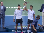 Champions Marcelo AREVALO and Jean-Julien ROJER lifting their Trophy