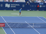 Alex DE MINAUR walking behind the baseline