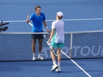 The match is over, and Alex De Minaur and Jannik Sinner are about to shake hands at the net