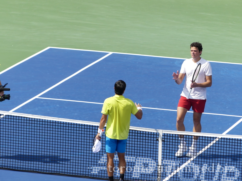 Mackanzie McDonald the winner is to shake hands with Milos Raonic 