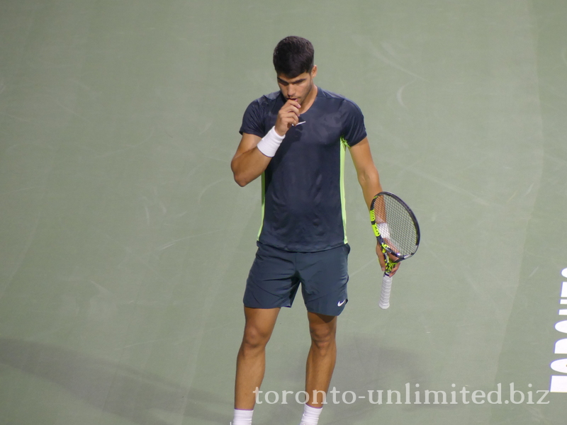 Carlos ALCARAZ (ESP) [1] standing on Centre Court  in deep thought