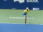 Mackanzie McDonald (USA) serving to Milos Raonic 