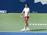 Milos Raonic to serve to Mackenzie McDonald on Centre Court