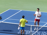 Mackanzie McDonald the winner is to shake hands with Milos Raonic 