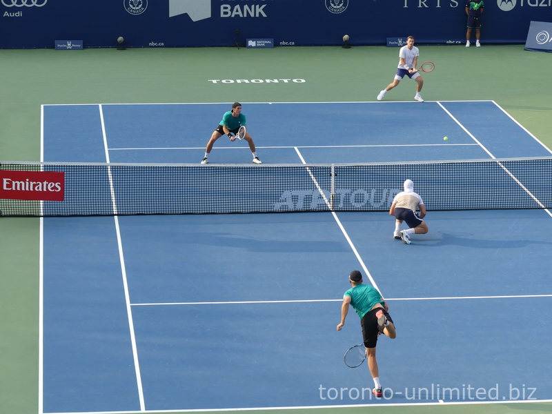 Julian Cash is serving on Centre Court in the second set tiebreaker on August 7, 2025, in the Championship Doubles Final.