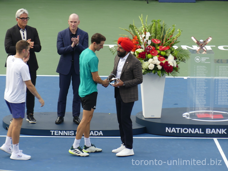 Now I'll invite Navdeep from Rogers Communications to present the National Bank, presented by Rogers, as the doubles runner-up with their Trophy