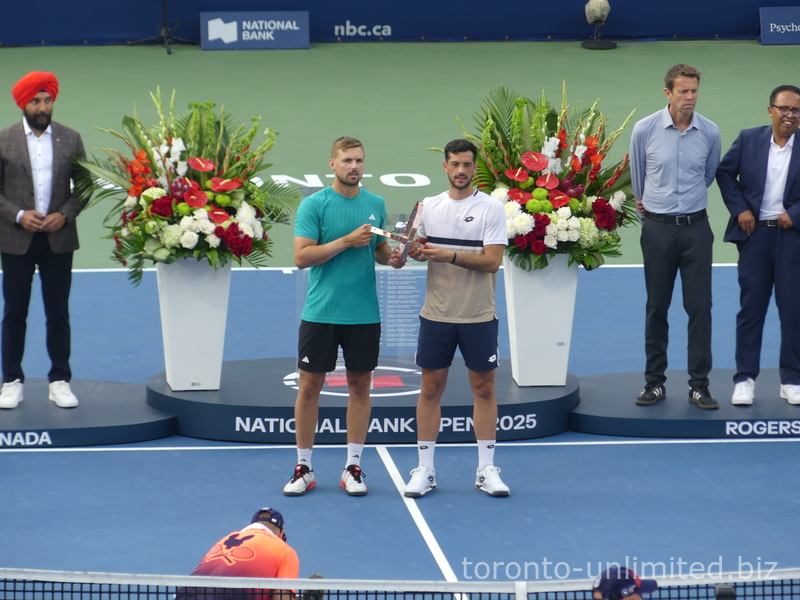 Champions Julian Cash and Lloyd Glasspool are posing for pictures during the Championship Closing Ceremony. NBO 2025 Toronto August 7, 2025