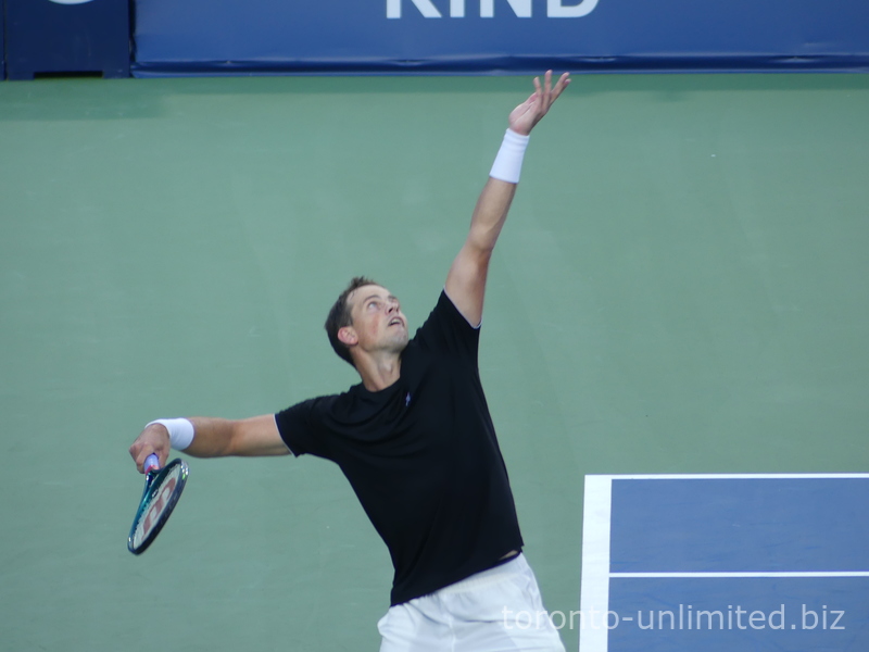 Canadian Vasek Pospisil is serving in a qualifying match on July 27, 2025. NBO 2025 Toronto.