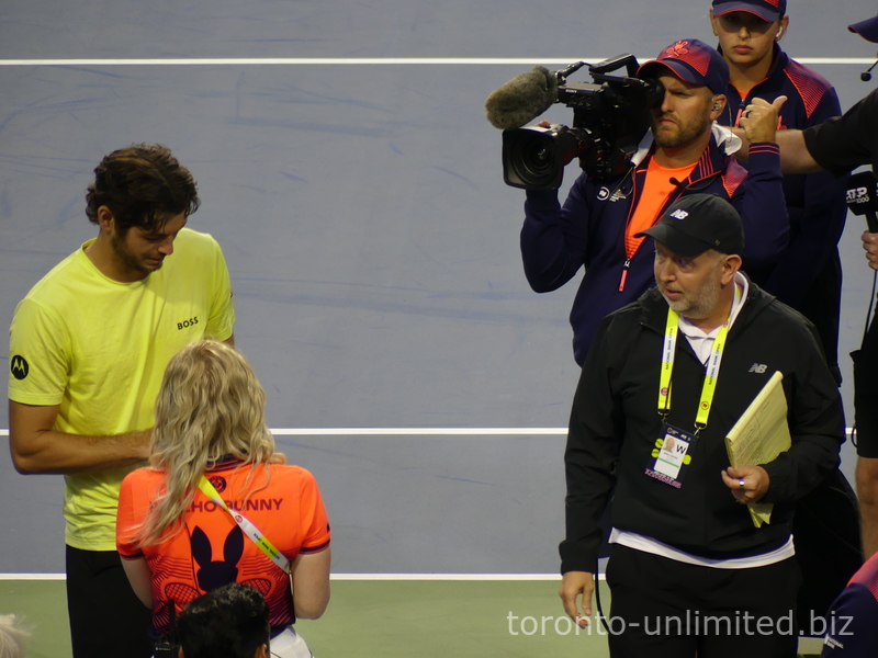 Taylor Fritz on the Court in the middle of an interview with Mike Cation, ATP Media reporter. August 1, 2025