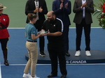 Matthew to presenting our Chair Umpire, Katia Radwan-Cho, with a token of appreciation from Tennis Canada and the National Bank Open.