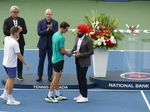 Now I'll invite Navdeep from Rogers Communications to present the National Bank, presented by Rogers, as the doubles runner-up with their Trophy